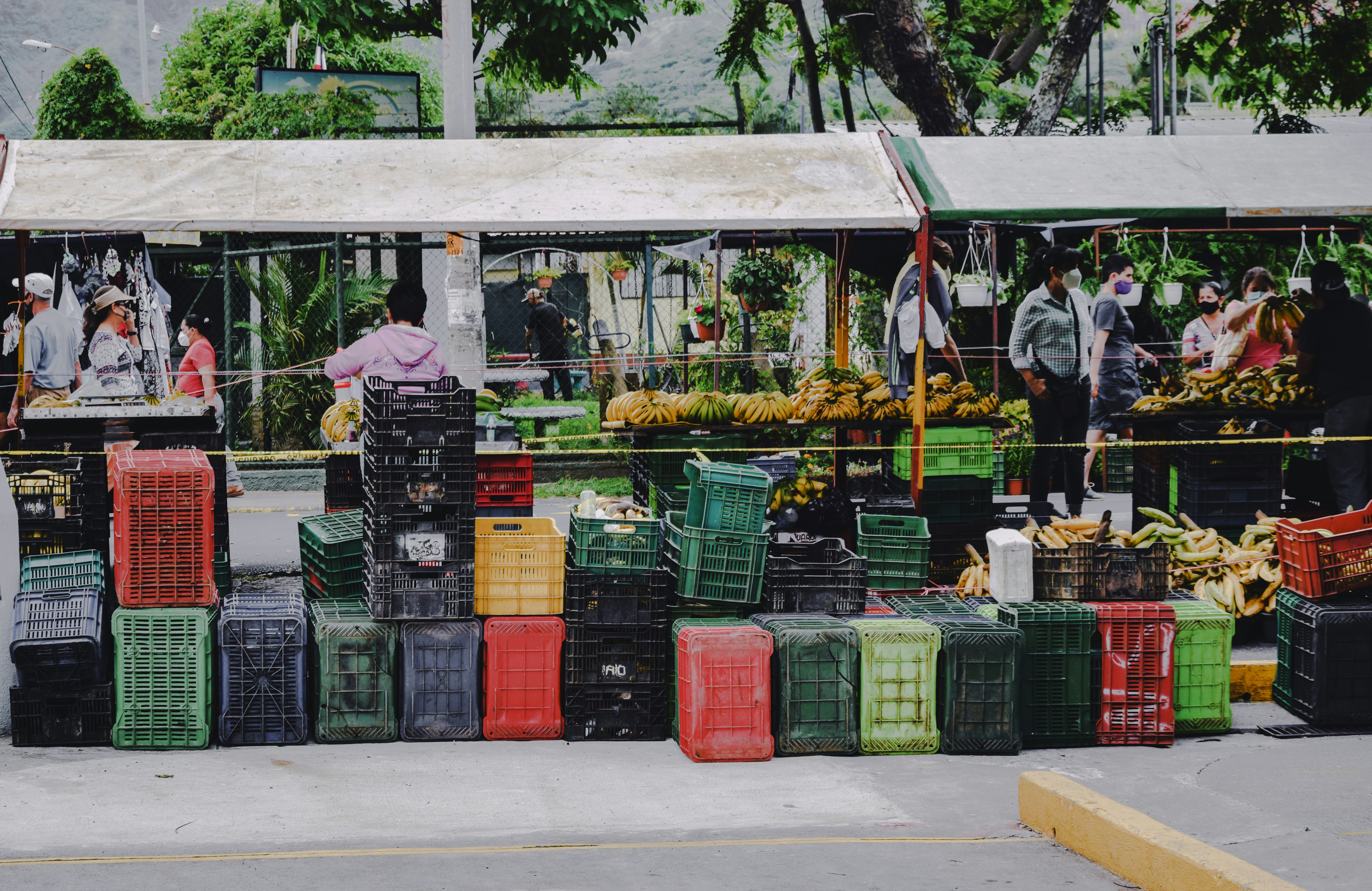 green and red plastic crates on gray concrete floor